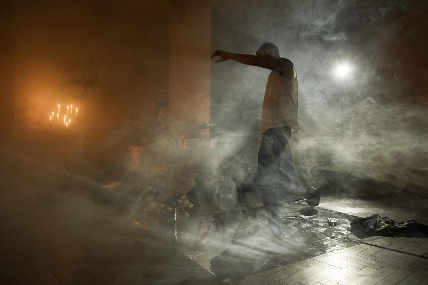 artist dancing in smoke
