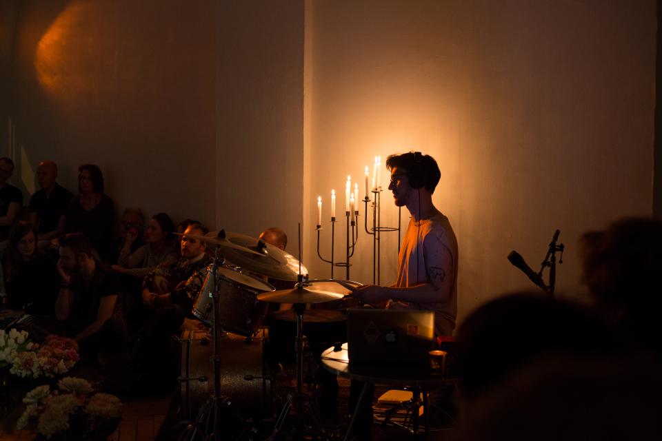 drummer in front of candles