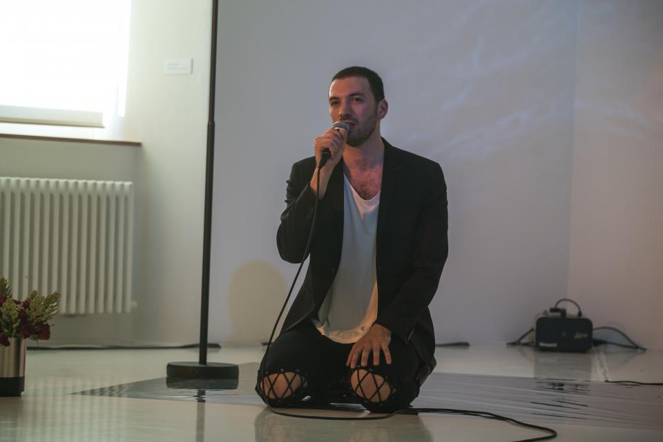artist on knees singing