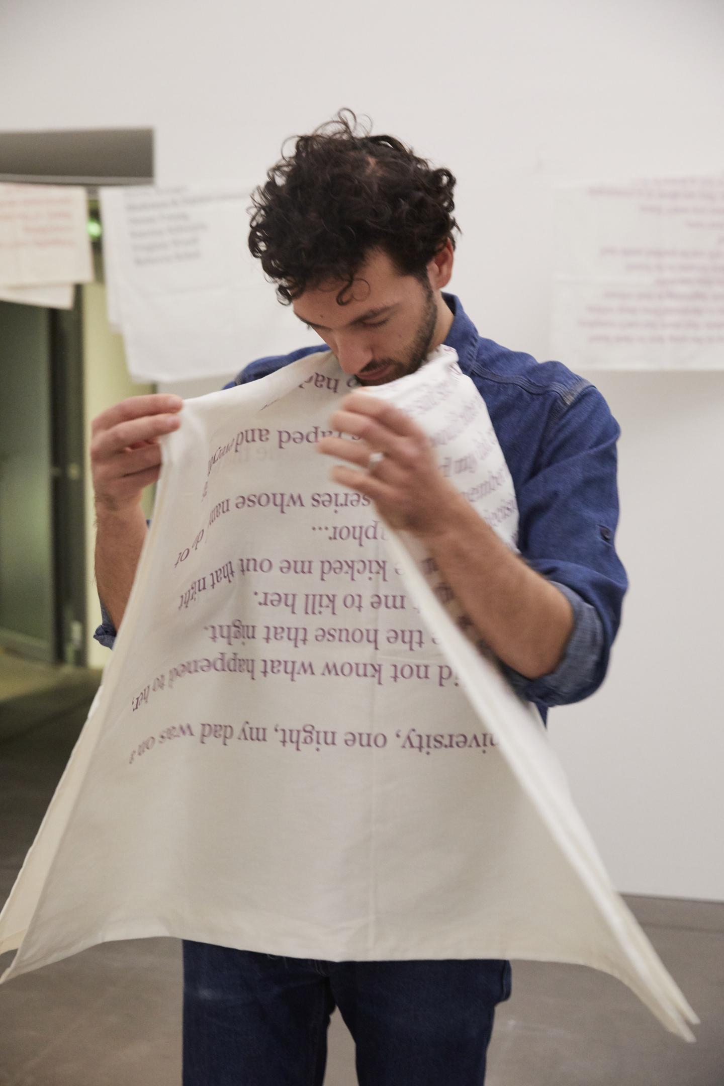 artist folds large fabric